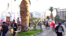 Protesters suffering the effects of tear gas in the central square of the city