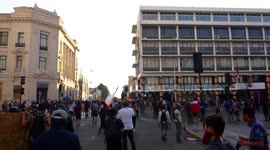 Protesters facing special forces, while destroying the city mayor's building