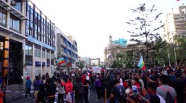 Protesters facing special forces are gassed, while destroying the city mayor's building