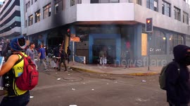 Protesters in the city center with bonfires and destroyed administrative buildings