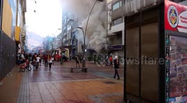 Fire in bank as a result of violent protests, firefighters in action