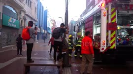 Fire in bank as a result of violent protests, firefighters in action