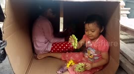 just at home, happy playing with the cardboard box