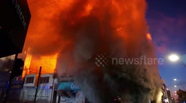 Old 1912 building on fire after the protests, one of the oldest in the city, firefighters in action