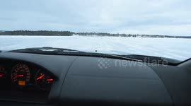 Swedish driver takes daring first trip across frozen lake ice road