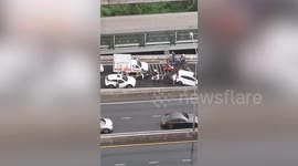 Dozens of vehicles skid and crash as rain causes slippy highway in Bangkok