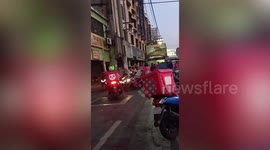 Food delivery riders hand out meals to hungry residents in the Philippines