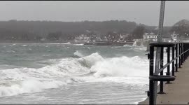 Large waves crash against Massachusetts seawall