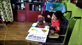 School dropout father in India builds robot to help feed his daughter with cerebral palsy