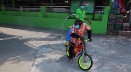 Thailand zoo sparks outrage after making chimpanzee ride a bike while spraying COVID-19 sanitiser