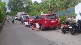 COVID-19 curfew violators punished to waddle down street in the Philippines