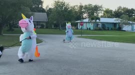 'Herd of Unicorns'! Quarantined people in Florida wear UNICORN suits to walk their dogs