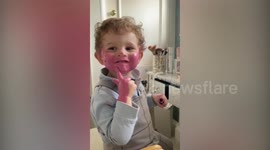 UK toddler smothers his face in pink LIPSTICK after discovering mum's makeup
