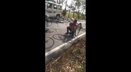 Watch - police make two people sit walk with holding their by cycle for violating lockdown rules