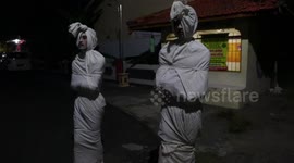 Two Youth Dress Up Like Ghosts to Scare Residents Out of the House During the Coronavirus Pandemic