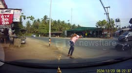 Motorcycle rider flings himself and passenger to the ground to avoid head-on collision