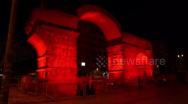Arch of Galerius in Thessaloniki turns red to show passion for those not able to attend church