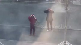 Elderly Chinese couple use binoculars to check on granddaughter quarantined in hotel