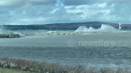 Spring storm sends large waves crashing into Lake Michigan