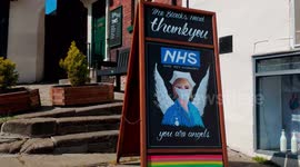 Sign outside The Blacks Head Pub with an angel picture which says 