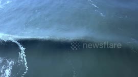 Drone captures large waves crashing onto seafront over the Hamptons in New York