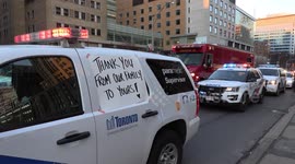 Emergency service convoy parades through Toronto to honour health care workers during COVID-19 pandemic