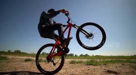 Crazy Mountain Biker riding on Back Wheel in slowmo!