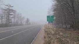 New Hampshire residents shocked as snow squall strikes in spring