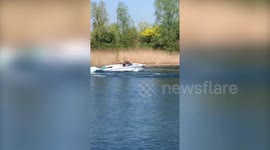 Cruel footage shows man circling around swan in speedboat on UK lake