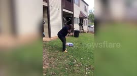 BBQ fail: Hilarious moment US man drops bag of charcoal on his brother's head