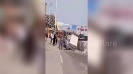 Huge stone block crushes car after falling off trailer in southern China