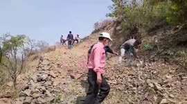 Locals use COVID-19 relaxation time to dig path across mountain in northern India