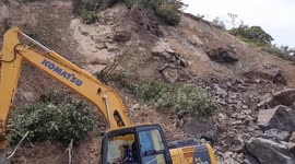 Shocking moment heavy equipment operators in Indonesia almost hit by two landslide aftershock