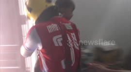 Dramatic moment firefighter rescues boy, 4, from burning home in Thailand