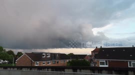 Thick storm clouds gather over East London