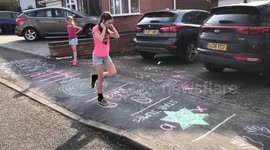 UK family create obstacle course out of chalk for their street to enjoy during COVID-19 lockdown