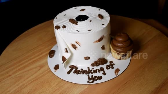 Disgusting toilet paper cake smeared with chocolate is perfect coronavirus consummable