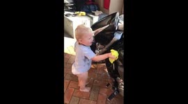 'Lazy' dad teaches two-year-old son how to clean motorbike so he doesn't have to