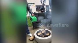 Dopey dad pours petrol on a BBQ