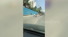 Hundreds queue up as liquor stores open with lockdown relaxations across southern India's Bangalore