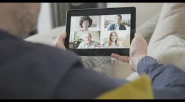 Video call with colleagues working from home on sofa with ipad, Business people video conference virtual meeting online wireless technology