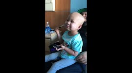 Three-year-old undergoing cancer treatment brushes up her makeup