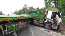 Articulated lorry smashes into car making a right turn across dual-carriageway in Thailand