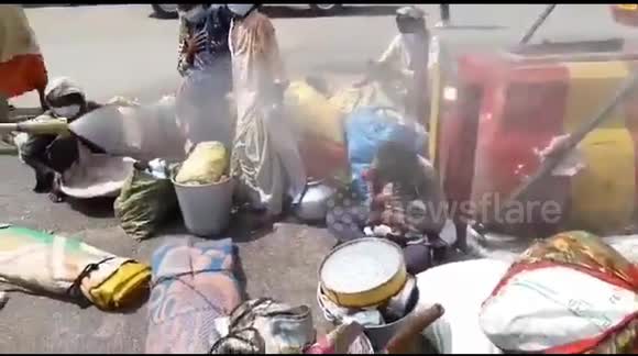 Migrant workers sprayed with disinfectants in a bid to sanitize them of Coronavirus after they arrived in Lucknow, Uttar Pradesh