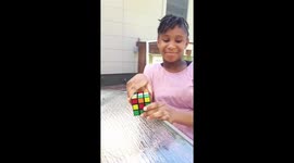 She amazes me with her talent by solving the magic cube