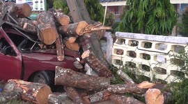 Security cam captures moment truck skids on wet road and slams into electricity post
