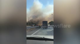 Drivers engulfed by clouds of smoke from farm fires in Thailand