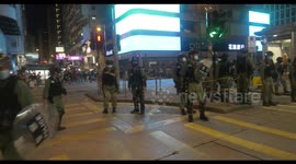 Hong Kong riot police stop and search journalists in Mong Kok