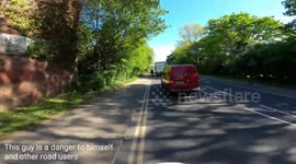 COVID madness. Talking is more dangerous according to man walking on the road with headphones on.