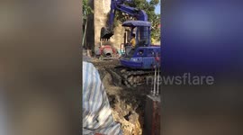 Schoolboy, 10, operates construction site digger in Vietnam